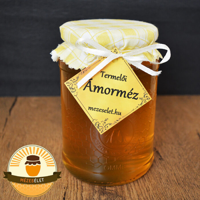 Ámorméz 1000 g üvegben szövet sapkával és szatén szalaggal díszítve, elegáns címkével ellátott termelői méz.
