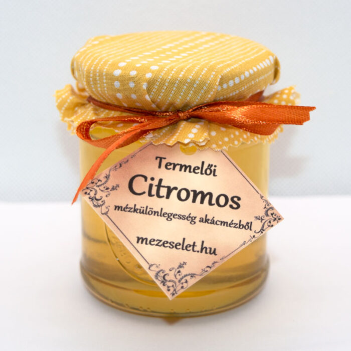 Citromos akácméz díszcsomagolásban, szövettel és szalaggal, nagy címkével.